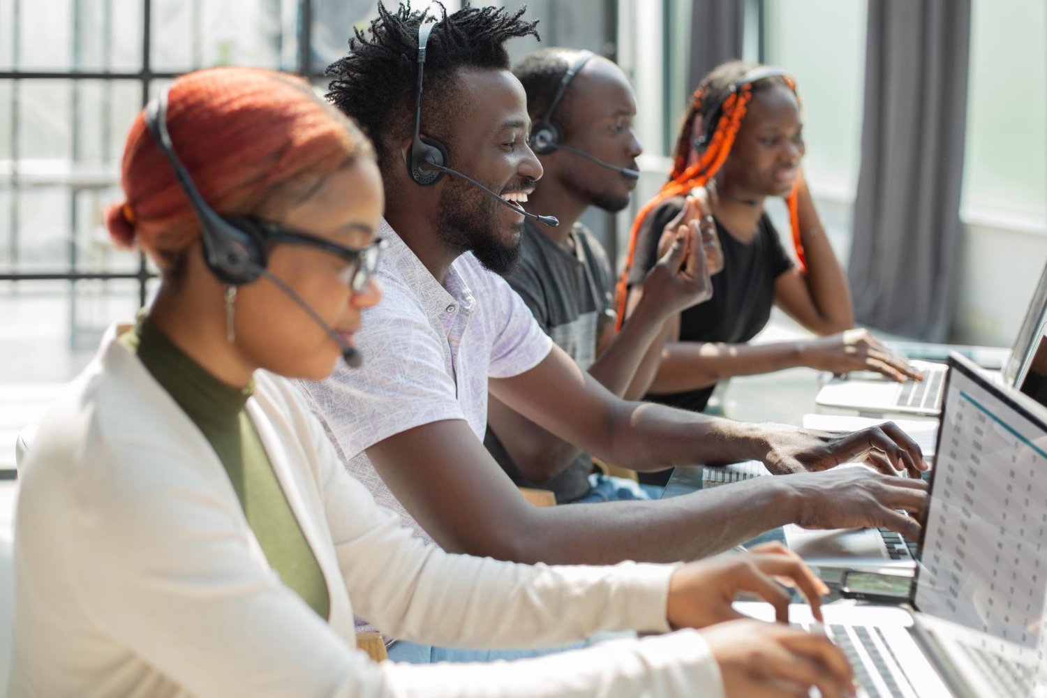 CallTawk agents smiling and talking warmly with callers